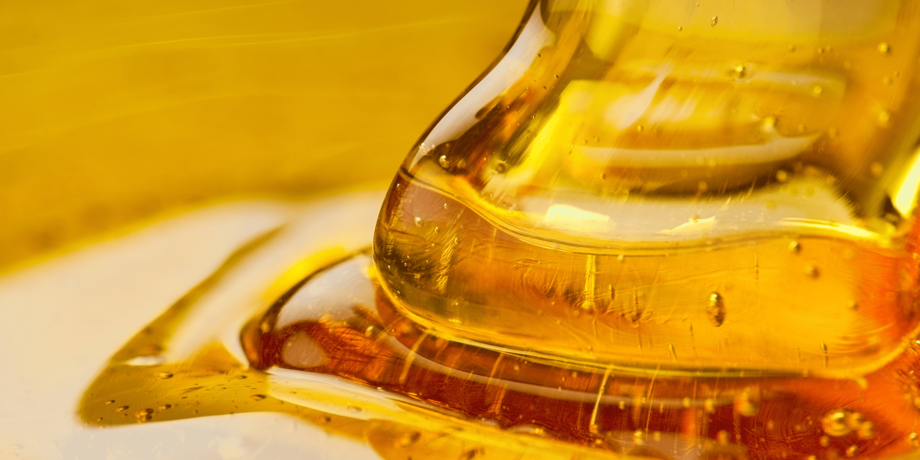 raw manuka honey flowing onto a surface